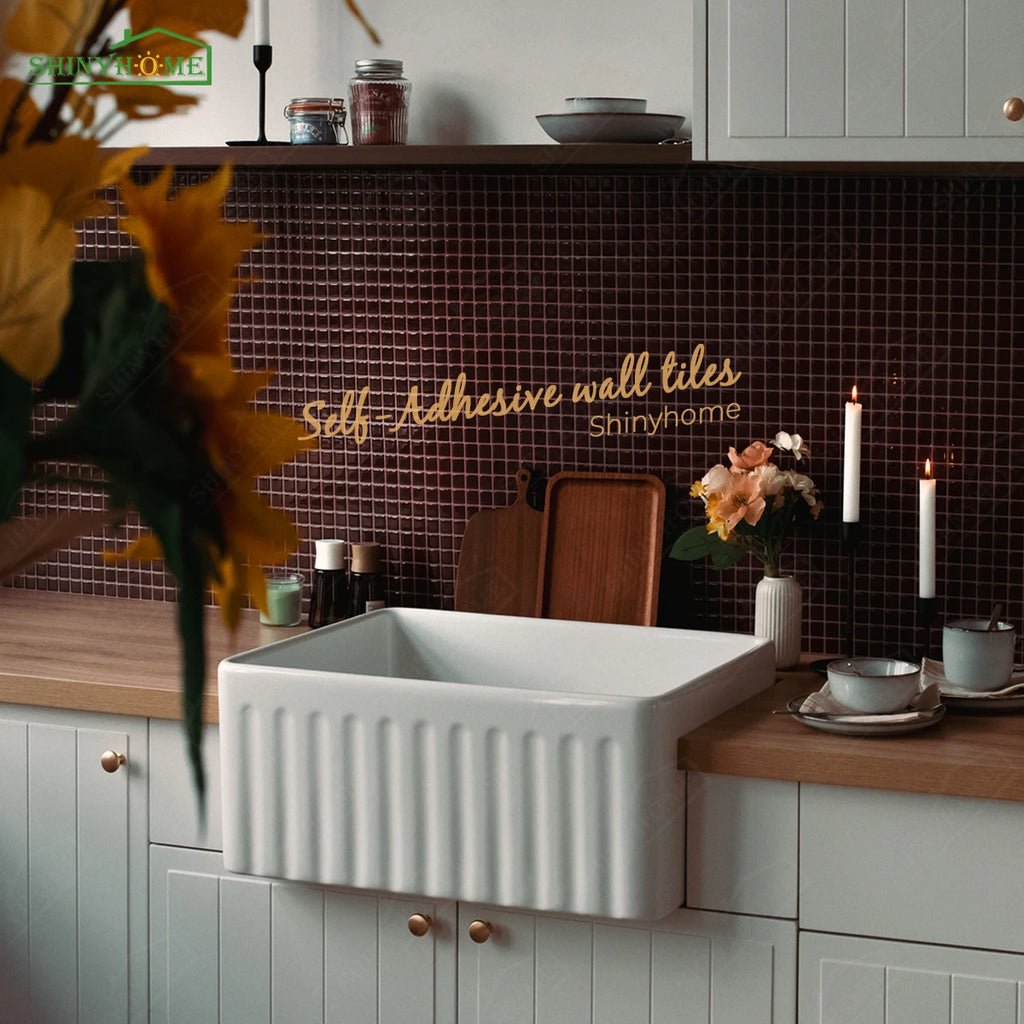 Burgundy mosaic tile backsplash in a kitchen with a white fluted sink, with overlaid text